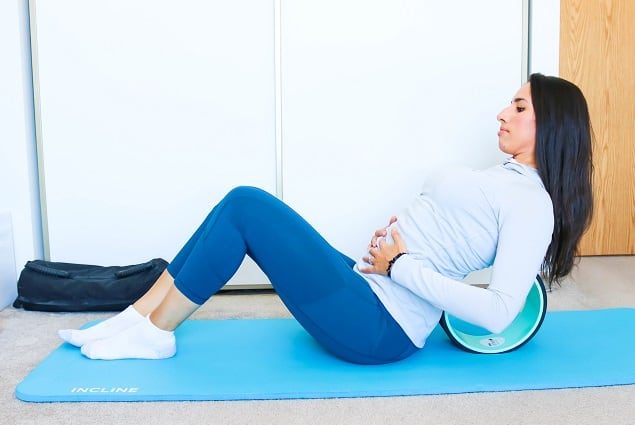 Yoga wheel back pain relief